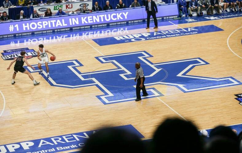 Kentucky-commit Reed Sheppard brings the ball up the court atop the large UK logo at the UK HealthCare Boys Sweet 16 tournament Wednesday at Rupp Arena. March 15, 2022

2022 Sweet Sixteen Boys Basketball Tournament