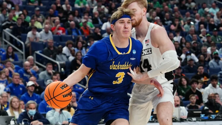 Mar 17, 2022; Buffalo, NY, USA; South Dakota State Jackrabbits guard Baylor Scheierman (3) drives to the basket against Providence Friars forward Noah Horchler (14) in the second half during the first round of the 2022 NCAA Tournament at KeyBank Center. Mandatory Credit: Gregory Fisher-USA TODAY Sports