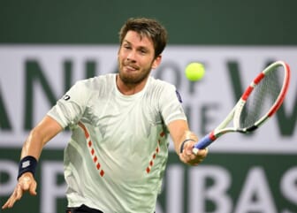 Mar 17, 2022; Indian Wells, CA, USA;  Cameron Norrie (GBR) hits a shot in his quarterfinal match against Carlos Alcaraz (ESP) at the BNP Paribas Open at the Indian Wells Tennis Garden. Mandatory Credit: Jayne Kamin-Oncea-USA TODAY Sports