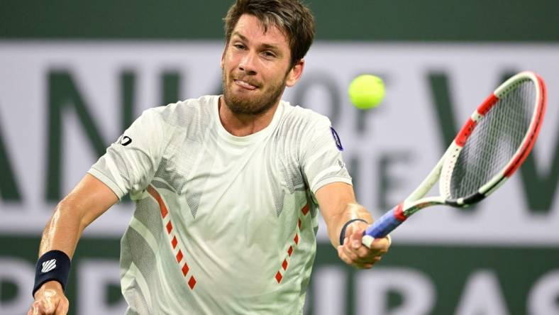 Mar 17, 2022; Indian Wells, CA, USA;  Cameron Norrie (GBR) hits a shot in his quarterfinal match against Carlos Alcaraz (ESP) at the BNP Paribas Open at the Indian Wells Tennis Garden. Mandatory Credit: Jayne Kamin-Oncea-USA TODAY Sports