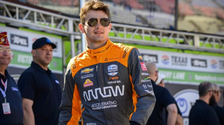 Mar 20, 2022; Fort Worth, Texas, USA; Arrow McLaren SP driver Pato O'Ward (5) of Mexico is introduced before the start of the NTT IndyCar Series XPEL 375 race at Texas Motor Speedway. Mandatory Credit: Jerome Miron-USA TODAY Sports
