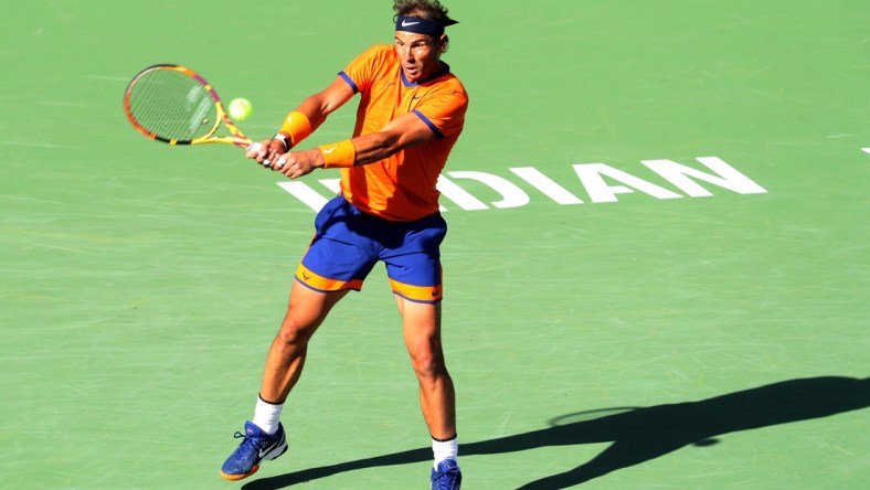 Rafael Nadal of Spain hits a return to American Taylor Fritz to during the men's final at the BNP Paribas Open in Indian Wells, Calif., on Sunday, March 2022.

Bnp Paribas Open Taylor Fritz Vs Rafael Nadal560