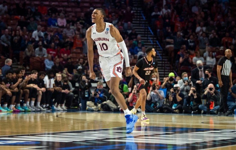 Auburn Tigers forward Jabari Smith (10) celebrates after making a three point basket during the first round of the 2022 NCAA tournament at Bon Secours Wellness Arena in Greenville, S.C., on Friday, March 18, 2022. Auburn Tigers lead Jacksonville State Gamecocks 39-27 at halftime.