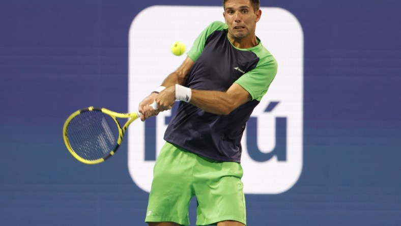 Mar 24, 2022; Miami Gardens, FL, USA; Federico Delbonis (ARG) hits a backhand against Andy Murray (GBR) (not pictured) in a first round men's singles match in the Miami Open at Hard Rock Stadium. Mandatory Credit: Geoff Burke-USA TODAY Sports