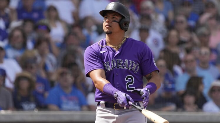 Mar 25, 2022; Mesa, Arizona, USA; Colorado Rockies center fielder Yonathan Daza (2) hits against the Chicago Cubs in the second inning during a spring training game at Sloan Park. Mandatory Credit: Rick Scuteri-USA TODAY Sports