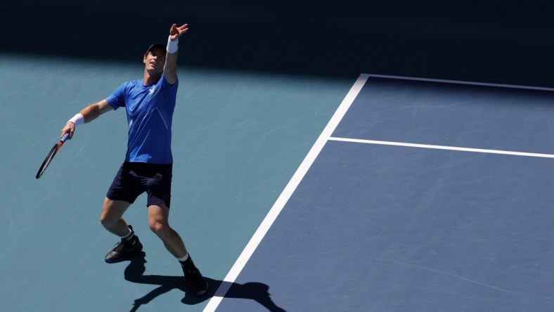 Mar 26, 2022; Miami Gardens, FL, USA; Andy Murray (GBR) serves against Daniil Medvedev (not pictured) in a second round men's singles match in the Miami Open at Hard Rock Stadium. Mandatory Credit: Geoff Burke-USA TODAY Sports