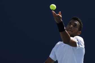 Mar 26, 2022; Miami Gardens, FL, USA; Felix Auger-Aliassime (CAN) serves against Miomir Kecmanovic (SRB)(not pictured) in a second round mens's singles match in the Miami Open at Hard Rock Stadium. Mandatory Credit: Geoff Burke-USA TODAY Sports
