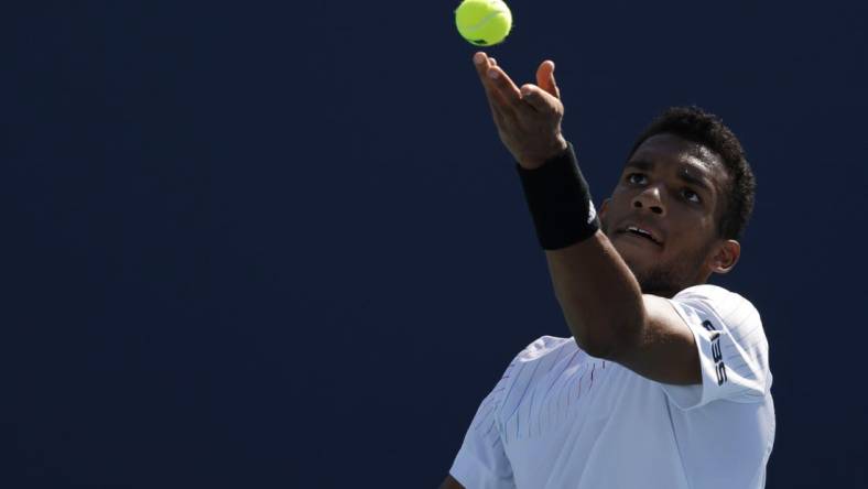 Mar 26, 2022; Miami Gardens, FL, USA; Felix Auger-Aliassime (CAN) serves against Miomir Kecmanovic (SRB)(not pictured) in a second round mens's singles match in the Miami Open at Hard Rock Stadium. Mandatory Credit: Geoff Burke-USA TODAY Sports