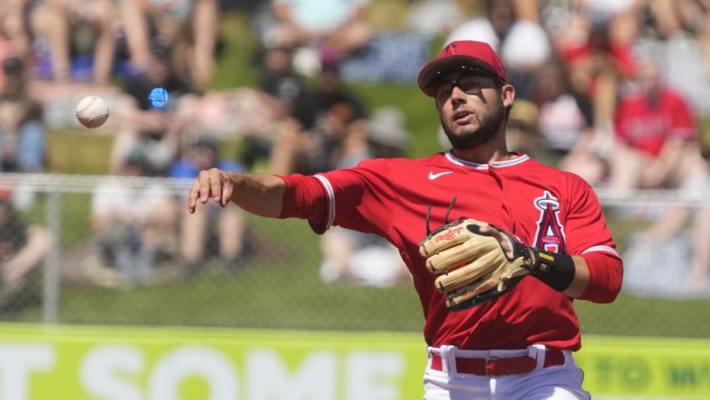 Mar 27, 2022; Tempe, Arizona, USA; Los Angeles Angels shortstop David Fletcher (22) makes the play against the San Francisco Giants during a spring training game at Tempe Diablo Stadium. Mandatory Credit: Rick Scuteri-USA TODAY Sports