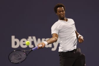 Mar 27, 2022; Miami Gardens, FL, USA; Gael Monfils (FRA) hits a forehand against Francisco Cerundolo (ARG)(not pictured) in a third round men's singles match in the Miami Open at Hard Rock Stadium. Mandatory Credit: Geoff Burke-USA TODAY Sports