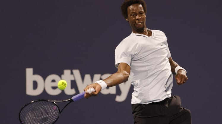 Mar 27, 2022; Miami Gardens, FL, USA; Gael Monfils (FRA) hits a forehand against Francisco Cerundolo (ARG)(not pictured) in a third round men's singles match in the Miami Open at Hard Rock Stadium. Mandatory Credit: Geoff Burke-USA TODAY Sports