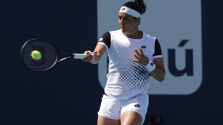 Mar 28, 2022; Miami Gardens, FL, USA; Ons Jabeur (TUN) hits a forehand against Danielle Collins (USA)(not pictured) in a fourth round women's singles match in the Miami Open at Hard Rock Stadium. Mandatory Credit: Geoff Burke-USA TODAY Sports