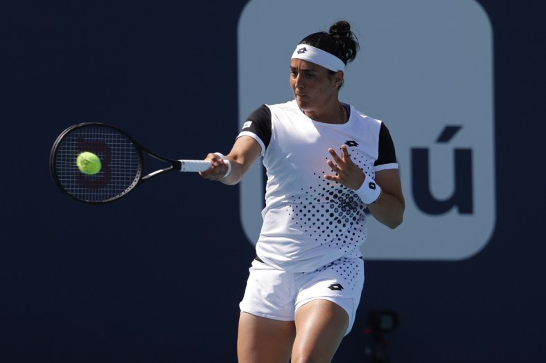 Mar 28, 2022; Miami Gardens, FL, USA; Ons Jabeur (TUN) hits a forehand against Danielle Collins (USA)(not pictured) in a fourth round women's singles match in the Miami Open at Hard Rock Stadium. Mandatory Credit: Geoff Burke-USA TODAY Sports