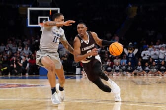 Mar 29, 2022; New York, New York, USA; St. Bonaventure Bonnies guard Kyle Lofton (0) dribbles the ball against Xavier Musketeers guard Dwon Odom (11) during second half of the NIT college basketball semifinals at Madison Square Garden. Mandatory Credit: Gregory Fisher-USA TODAY Sports