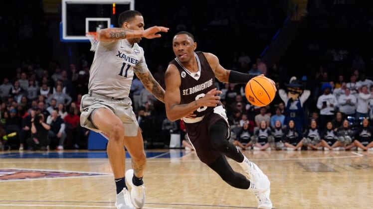 Mar 29, 2022; New York, New York, USA; St. Bonaventure Bonnies guard Kyle Lofton (0) dribbles the ball against Xavier Musketeers guard Dwon Odom (11) during second half of the NIT college basketball semifinals at Madison Square Garden. Mandatory Credit: Gregory Fisher-USA TODAY Sports