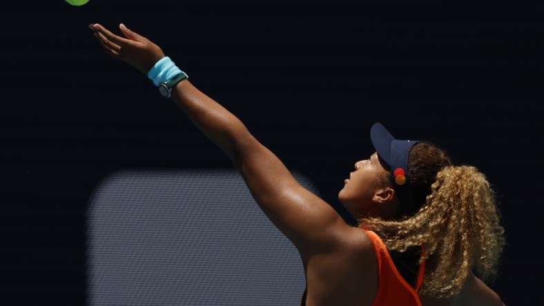 Apr 2, 2022; Miami Gardens, FL, USA; Naomi Osaka (JPN) hits a backhand against Iga Swiatek (POL)(not pictured) in the women's singles final in the Miami Open at Hard Rock Stadium. Mandatory Credit: Geoff Burke-USA TODAY Sports