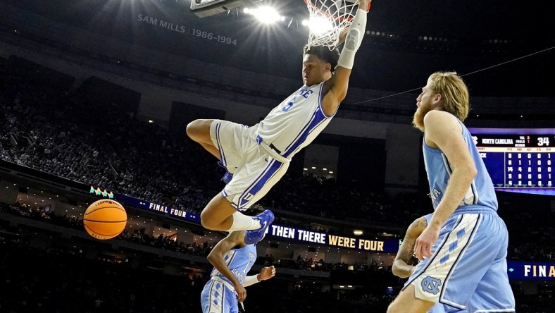 Apr 2, 2022; New Orleans, LA, USA; Duke Blue Devils forward Paolo Banchero (5) dunks the ball against North Carolina Tar Heels forward Brady Manek (45) during the second half in the 2022 NCAA men's basketball tournament Final Four semifinals at Caesars Superdome. Mandatory Credit: Robert Deutsch-USA TODAY Sports