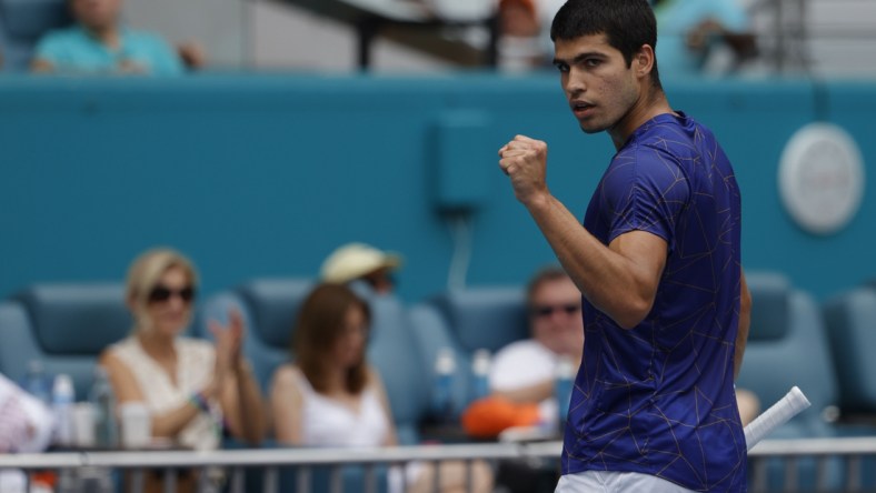 Apr 3, 2022; Miami Gardens, FL, USA; Carlos Alcaraz (ESP) reacts after winning a point against Casper Ruud (NOR)(not pictured) in the men's singles final in the Miami Open at Hard Rock Stadium. Mandatory Credit: Geoff Burke-USA TODAY Sports