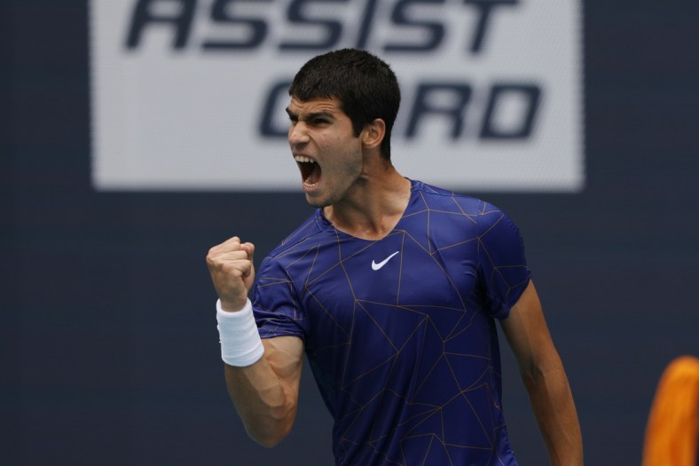 Apr 3, 2022; Miami Gardens, FL, USA; Carlos Alcaraz (ESP) reacts after winning a point against Casper Ruud (NOR)(not pictured) in the men's singles final in the Miami Open at Hard Rock Stadium. Mandatory Credit: Geoff Burke-USA TODAY Sports