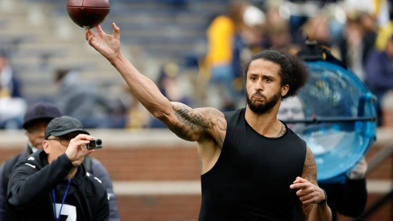 Apr 2, 2022; Ann Arbor, Michigan, USA;  Colin Kaepernick passes during halftime at the Michigan Spring game at Michigan Stadium. Mandatory Credit: Rick Osentoski-USA TODAY Sports