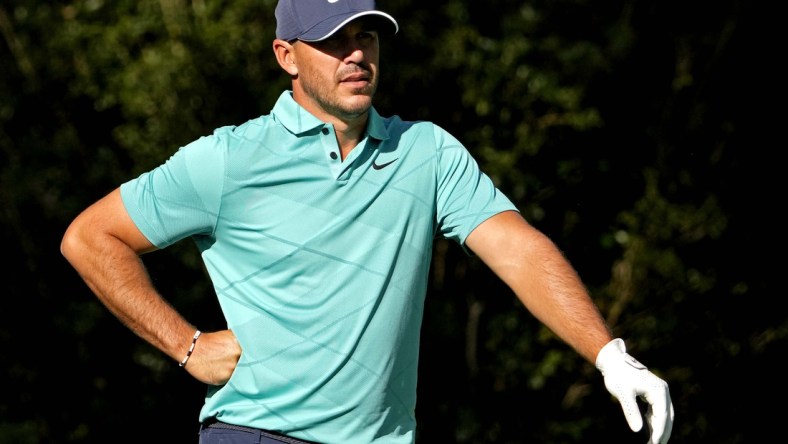 Apr 7, 2022; Augusta, Georgia, USA; Brooks Koepka waits on the 11th tee during the first round of The Masters golf tournament. Mandatory Credit: Michael Madrid-USA TODAY Sports