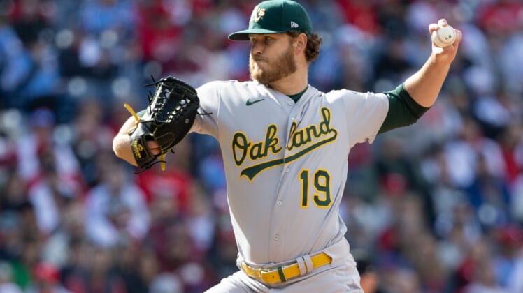 Apr 9, 2022; Philadelphia, Pennsylvania, USA; Oakland Athletics starting pitcher Cole Irvin (19) throws a pitch against the Philadelphia Phillies during the first inning at Citizens Bank Park. Mandatory Credit: Bill Streicher-USA TODAY Sports
