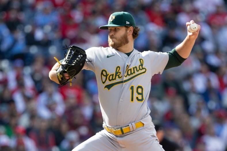 Apr 9, 2022; Philadelphia, Pennsylvania, USA; Oakland Athletics starting pitcher Cole Irvin (19) throws a pitch against the Philadelphia Phillies during the first inning at Citizens Bank Park. Mandatory Credit: Bill Streicher-USA TODAY Sports