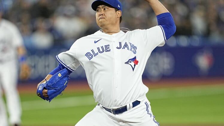 Apr 10, 2022; Toronto, Ontario, CAN; Toronto Blue Jays pitcher Hyun Jin Ryu (99) pitches to the Texas Rangers during the first inning at Rogers Centre. Mandatory Credit: John E. Sokolowski-USA TODAY Sports