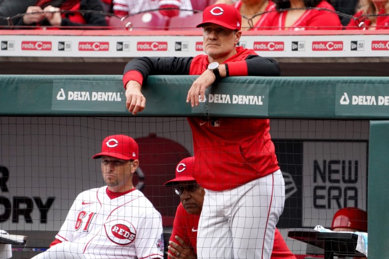 Cincinnati Reds manager David Bell (25) watches the game in the third inning during a baseball game against the Cleveland Guardians, Tuesday, April 12, 2022, at Great American Ball Park in Cincinnati, Ohio.

Cleveland Guardians At Cincinnati Reds Home Opener April 12 0373