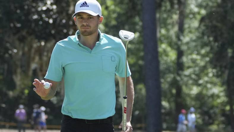 Apr 15, 2022; Hilton Head, South Carolina, USA; Aaron Wise acknowledges the fans after a birdie on the 5th hole during the second round of the RBC Heritage golf tournament. Mandatory Credit: David Yeazell-USA TODAY Sports