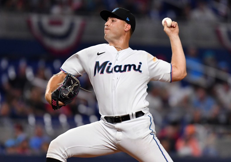 Apr 16, 2022; Miami, Florida, USA; Miami Marlins relief pitcher Daniel Castano (20) pitches against the Philadelphia Phillies at loanDepot Park. Mandatory Credit: Jim Rassol-USA TODAY Sports