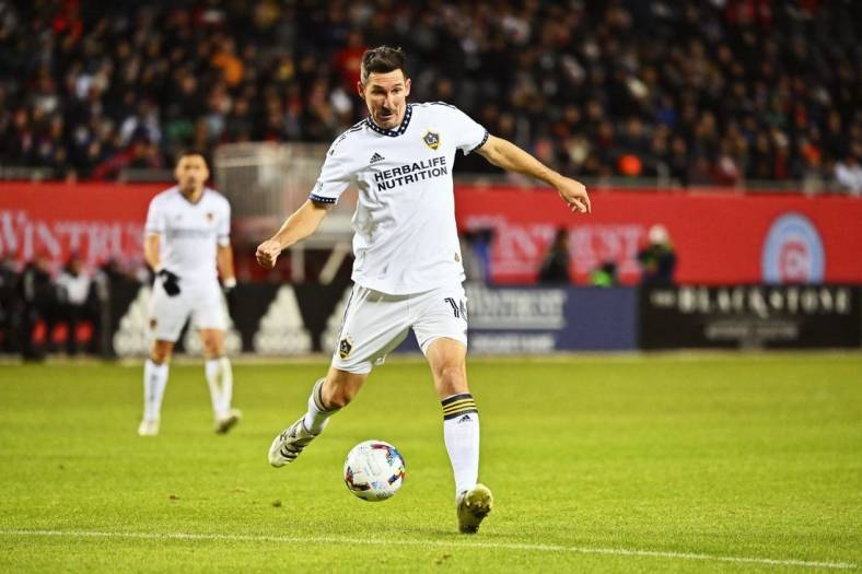 Apr 16, 2022; Chicago, Illinois, USA;  LA Galaxy midfielder Sacha Kljestan (16) controls the ball against the Chicago Fire FC at Soldier Field. Mandatory Credit: Jamie Sabau-USA TODAY Sports