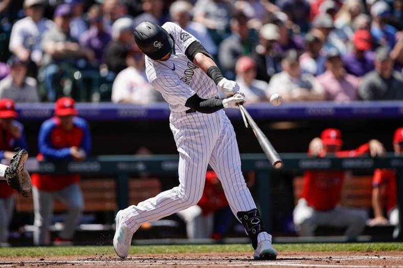 Apr 20, 2022; Denver, Colorado, USA; Colorado Rockies left fielder Kris Bryant (23) breaks his bat on a single in the first inning against the Philadelphia Phillies at Coors Field. Mandatory Credit: Isaiah J. Downing-USA TODAY Sports