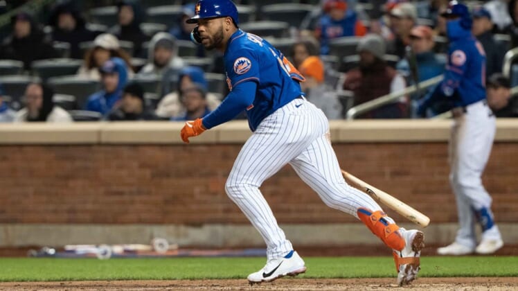Apr 19, 2022; New York City, New York, USA; New York Mets left fielder Dominic Smith (2) hits a single against the San Francisco Giants during the sixth inning at Citi Field. Mandatory Credit: Gregory Fisher-USA TODAY Sports