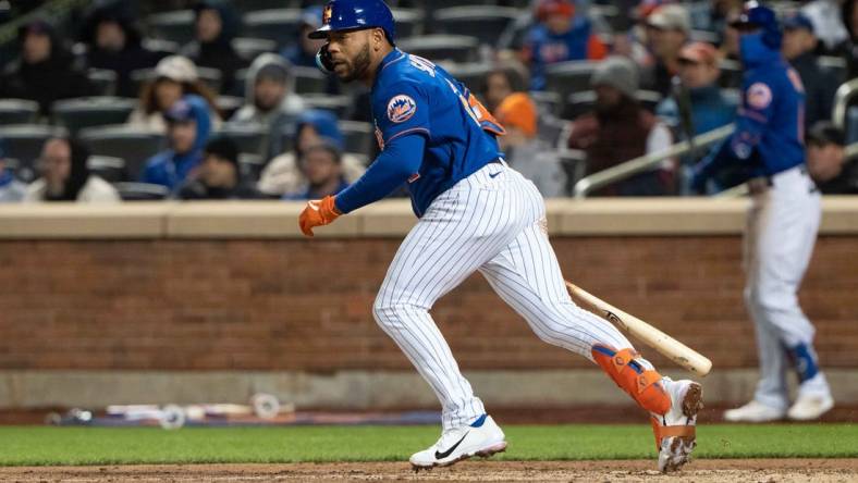 Apr 19, 2022; New York City, New York, USA; New York Mets left fielder Dominic Smith (2) hits a single against the San Francisco Giants during the sixth inning at Citi Field. Mandatory Credit: Gregory Fisher-USA TODAY Sports