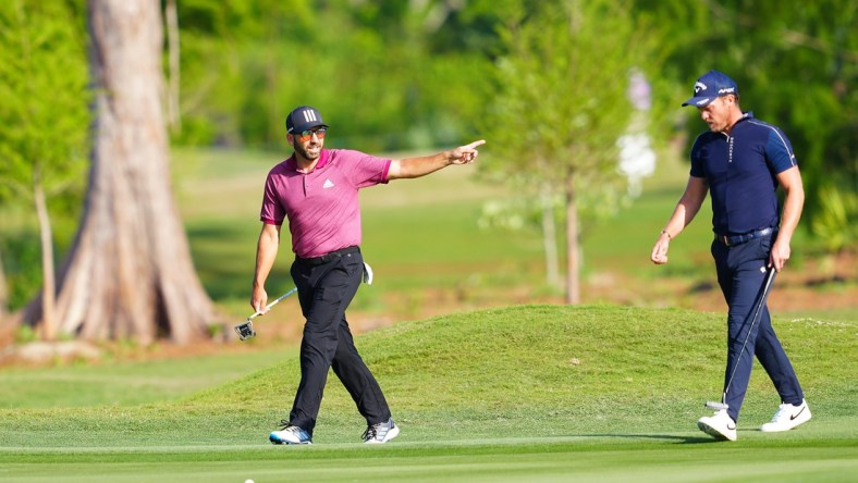 Apr 21, 2022; Avondale, Louisiana, USA; Sergio Garcia and Danny Willett walk on the 12th fairway during the first round of the Zurich Classic of New Orleans golf tournament. Mandatory Credit: Andrew Wevers-USA TODAY Sports