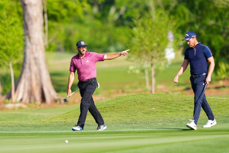 Apr 21, 2022; Avondale, Louisiana, USA; Sergio Garcia and Danny Willett walk on the 12th fairway during the first round of the Zurich Classic of New Orleans golf tournament. Mandatory Credit: Andrew Wevers-USA TODAY Sports