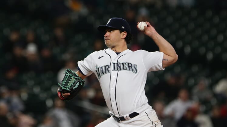 Apr 21, 2022; Seattle, Washington, USA;  Seattle Mariners starting pitcher Marco Gonzales (7) delivers during the second inning against the Texas Rangers at T-Mobile Park. Mandatory Credit: Lindsey Wasson-USA TODAY Sports