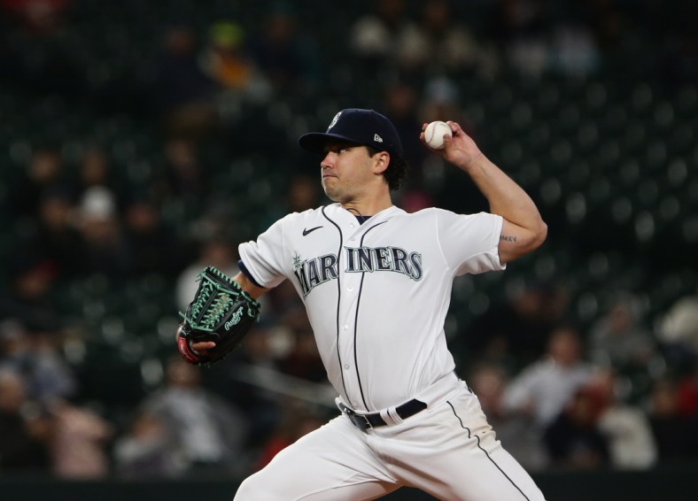Apr 21, 2022; Seattle, Washington, USA;  Seattle Mariners starting pitcher Marco Gonzales (7) delivers during the second inning against the Texas Rangers at T-Mobile Park. Mandatory Credit: Lindsey Wasson-USA TODAY Sports