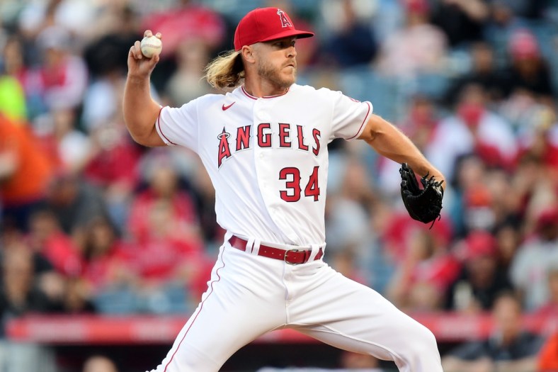 Apr 23, 2022; Anaheim, California, USA; Los Angeles Angels starting pitcher Noah Syndergaard (34) throws against the Baltimore Orioles during the first inning at Angel Stadium. Mandatory Credit: Gary A. Vasquez-USA TODAY Sports