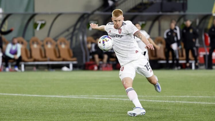 Apr 23, 2022; Portland, Oregon, USA; Real Salt Lake defender Justen Glad (15) takes a shot on goal during the second half against the Portland Timbers at Providence Park. Mandatory Credit: Soobum Im-USA TODAY Sports