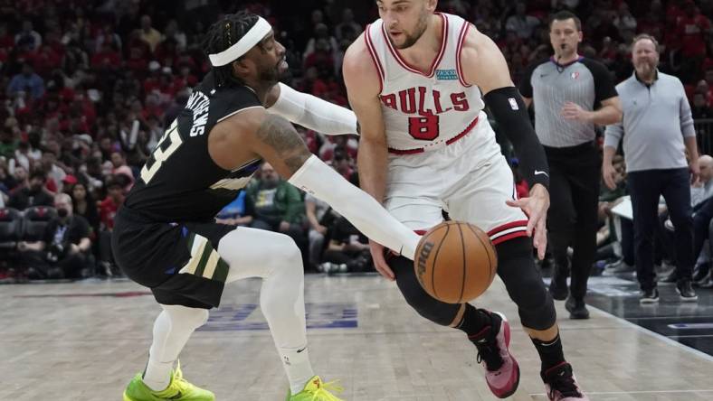 Apr 24, 2022; Chicago, Illinois, USA; Milwaukee Bucks guard Wesley Matthews (23) defends Chicago Bulls guard Zach LaVine (8) in the second half during game four of the first round for the 2022 NBA playoffs at United Center. Mandatory Credit: David Banks-USA TODAY Sports