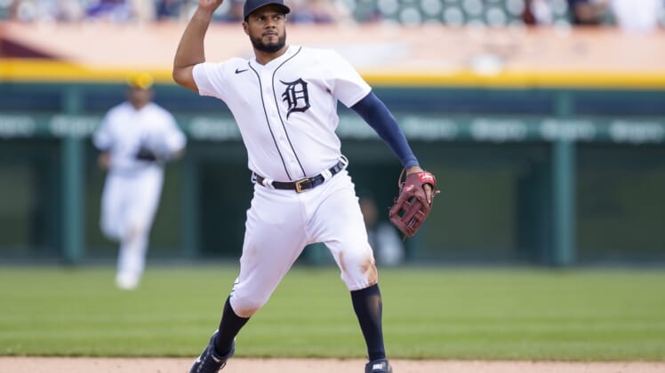 Apr 24, 2022; Detroit, Michigan, USA; Detroit Tigers third baseman Jeimer Candelario (46) makes a throw to first base for an out during the ninth inning against the Colorado Rockies at Comerica Park. Mandatory Credit: Raj Mehta-USA TODAY Sports