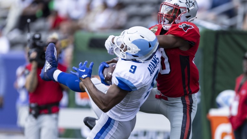 Apr 24, 2022; Birmingham, AL, USA; New Orleans Breakers wide receiver Jonathan Adams (9) catches the ball with Tampa Bay Bandits defensive back Quenton Meeks (30) on tight defense during the first half at Protective Stadium. Mandatory Credit: Vasha Hunt-USA TODAY Sports