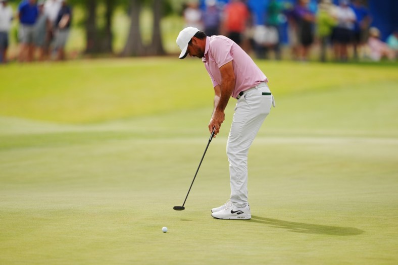 Apr 24, 2022; Avondale, Louisiana, USA; Jason Day putts on the 17th green during the final round of the Zurich Classic of New Orleans golf tournament. Mandatory Credit: Andrew Wevers-USA TODAY Sports