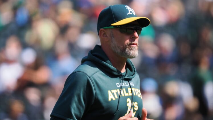 Apr 24, 2022; Oakland, California, USA; Oakland Athletics manager Mark Kotsay returns to the dugout after replacing the pitcher against the Texas Rangers during the eighth inning at RingCentral Coliseum. Mandatory Credit: Kelley L Cox-USA TODAY Sports