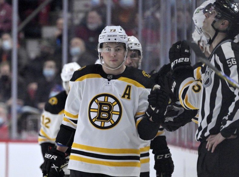 Apr 24, 2022; Montreal, Quebec, CAN; Boston Bruins defenseman Charlie McAvoy (73) celebrates with teammates after scoring a goal against the Montreal Canadiens during the second period at the Bell Centre. Mandatory Credit: Eric Bolte-USA TODAY Sports