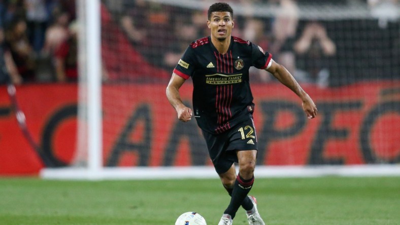 Apr 20, 2022; Kennesaw, Georgia, USA; Atlanta United defender Miles Robinson (12) dribbles against Chattanooga FC in the second half at Fifth Third Bank Stadium. Mandatory Credit: Brett Davis-USA TODAY Sports