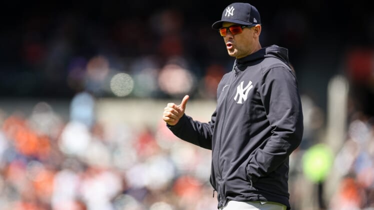 Apr 17, 2022; Baltimore, Maryland, USA; New York Yankees manager Aaron Boone (17) reacts against the Baltimore Orioles at Oriole Park at Camden Yards. Mandatory Credit: Scott Taetsch-USA TODAY Sports