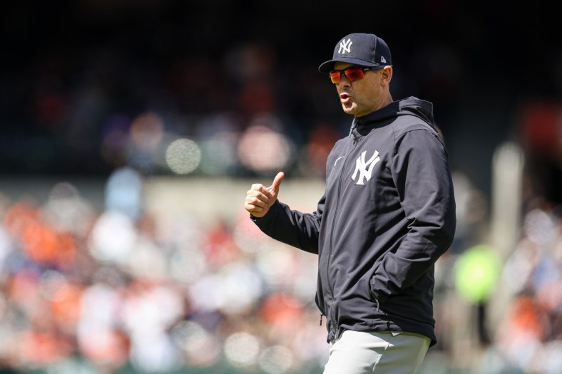 Apr 17, 2022; Baltimore, Maryland, USA; New York Yankees manager Aaron Boone (17) reacts against the Baltimore Orioles at Oriole Park at Camden Yards. Mandatory Credit: Scott Taetsch-USA TODAY Sports